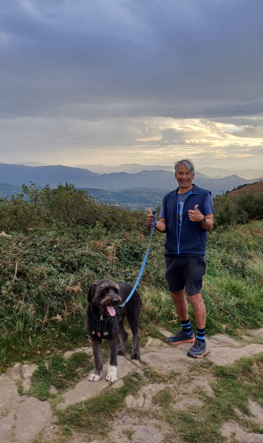 Wayne enjoying an outdoor hike with his dog